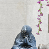 Ekaurr Humble Devotion Buddha handcrafted ceramic figurine in a reverent bowed posture, artisan spiritual sculpture for home altars and mindful living spaces