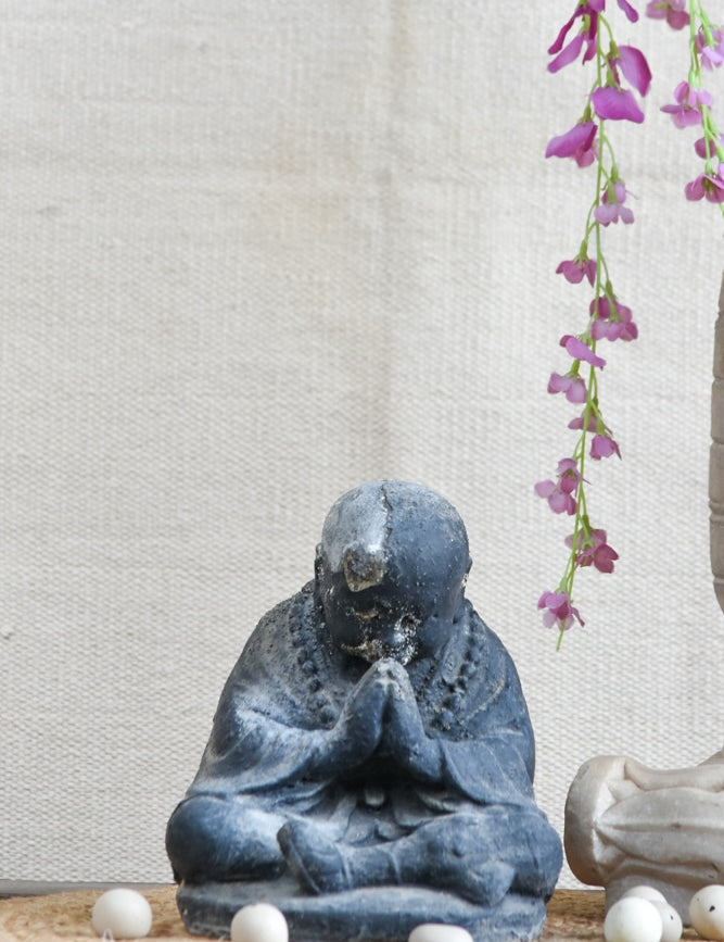 Ekaurr Humble Devotion Buddha handcrafted ceramic figurine in a reverent bowed posture, artisan spiritual sculpture for home altars and mindful living spaces