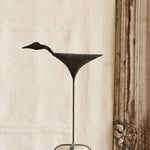 Ekaurr Iron Bird on Pebble Base Decor handcrafted matte iron bird figurine perched on a natural pebble base, artisan decorative accent for shelves consoles and nature-inspired home styling
