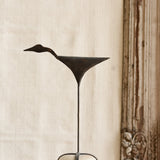 Ekaurr Iron Bird on Pebble Base Decor handcrafted matte iron bird figurine perched on a natural pebble base, artisan decorative accent for shelves consoles and nature-inspired home styling