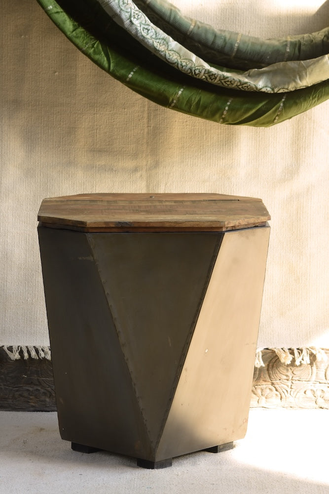 Front view of Ekaurr Iron-Clad Hexagonal Storage Coffee Table showing handcrafted metal cladding and wood surface