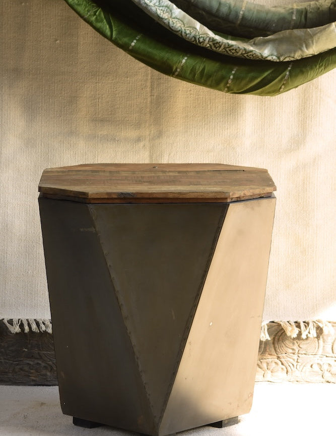 Front view of Ekaurr Iron-Clad Hexagonal Storage Coffee Table showing handcrafted metal cladding and wood surface