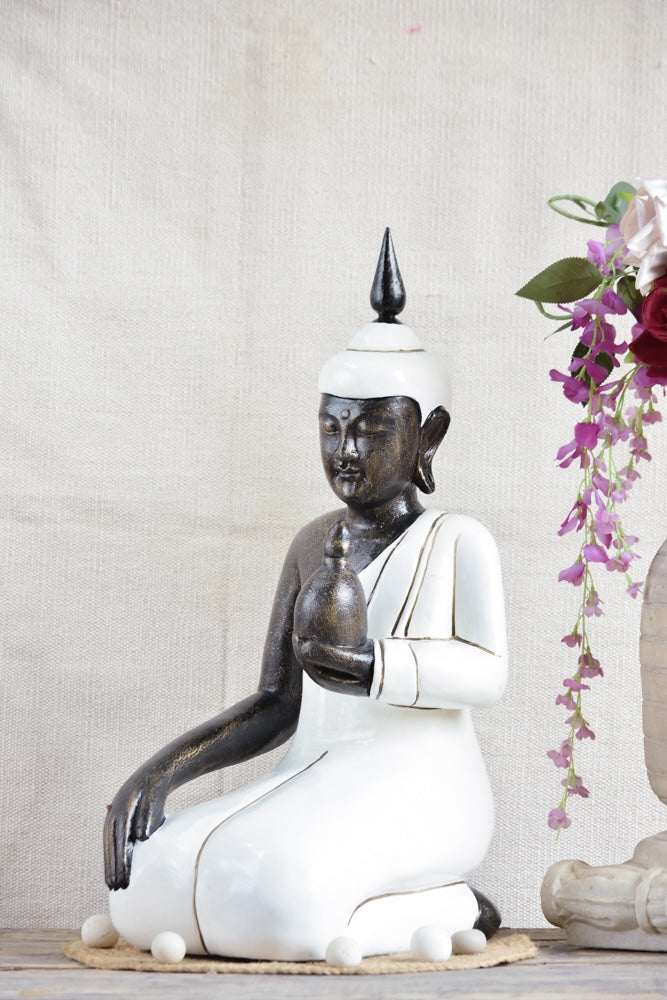 Ekaurr Ivory Grace Buddha handcrafted ceramic figurine in soft ivory finish with a graceful meditative posture, spiritual home decor sculpture for shelves or sacred spaces