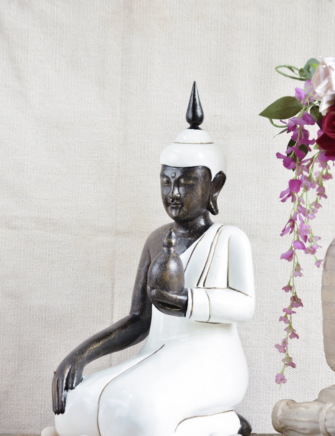 Ekaurr Ivory Grace Buddha handcrafted ceramic figurine in soft ivory finish with a graceful meditative posture, spiritual home decor sculpture for shelves or sacred spaces