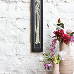Ekaurr Javanese Elegance Golden Embrace framed wall art depicting a traditional Javanese embracing figure in rich gold and warm tones, handcrafted cultural home decor for living rooms and globally inspired interiors