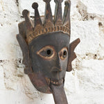 Ekaurr Kali Roar Tribal Tongue Mask detail showing hand-carved crown motifs, expressive tongue and aged reclaimed wood patina