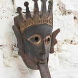Ekaurr Kali Roar Tribal Tongue Mask detail showing hand-carved crown motifs, expressive tongue and aged reclaimed wood patina