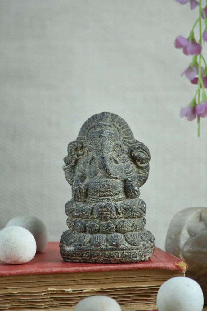 Ekaurr Lotus Wisdom Lord Ganesha idol in earthy raw stone finish seated on lotus base, minimalist devotional figurine for desks shelves and pooja spaces