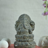 Ekaurr Lotus Wisdom Lord Ganesha idol in earthy raw stone finish seated on lotus base, minimalist devotional figurine for desks shelves and pooja spaces