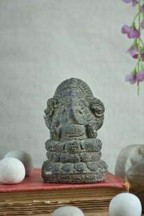 Ekaurr Lotus Wisdom Lord Ganesha idol in earthy raw stone finish seated on lotus base, minimalist devotional figurine for desks shelves and pooja spaces