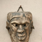 Ekaurr One of a Kind Tribal Mask hand-carved wood tribal ceremonial mask with bold expressive features and natural earthy finish, unique artisan one-of-a-kind wall decor for collectors and curated home interiors