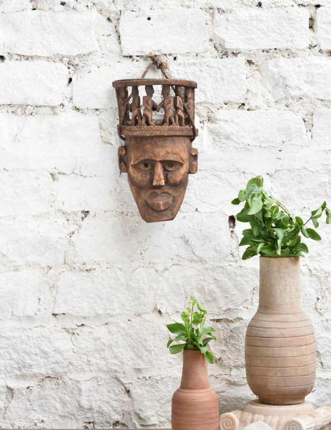 Ekaurr Peace Maker Circle of Kin Tribal Bond hand-carved wooden wall mask showing multiple connected figures, vintage one-of-a-kind tribal community décor