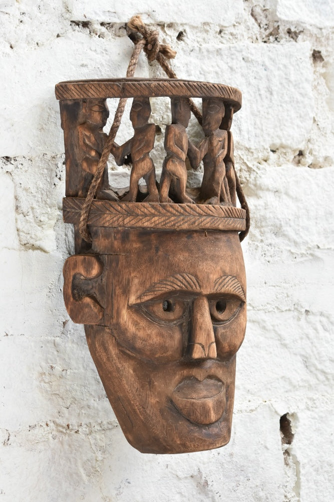 Ekaurr Peace Maker Tribal Bond Mask side view showing carved depth, figure detail and aged wood patina