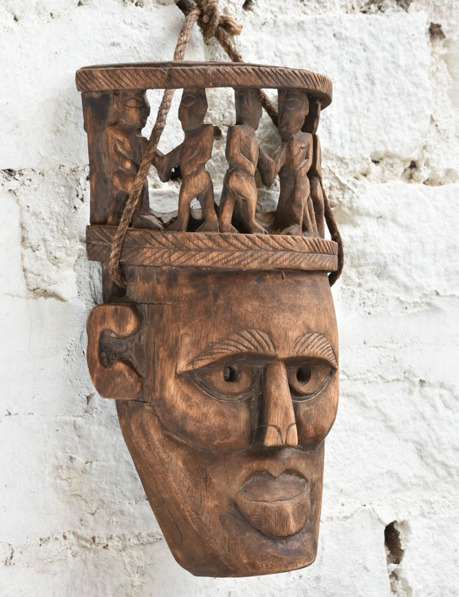 Ekaurr Peace Maker Tribal Bond Mask side view showing carved depth, figure detail and aged wood patina