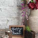 Ekaurr Pebbles Petals and Flame Gift Set curated artisan gift set combining natural river pebbles dried botanical petals and handcrafted tea light holders with complimentary greeting card, organic sustainable gifting for nature-inspired home styling