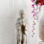 Ekaurr Praying Monk handcrafted ceramic figurine with hands folded in prayer, artisan spiritual sculpture evoking devotion and stillness for home altars and shelves