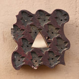 Close-up of Ekaurr Print Block Mirror showing intricate hand-carved motifs and aged patina on repurposed wooden printing block