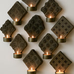 Ekaurr Hand Carved Print Block Wall Sconces with Brass Bowls set of 9 vintage wooden print blocks mounted as wall sconces each holding a brass bowl for tea lights or botanicals, artisan heritage wall display for curated home interiors