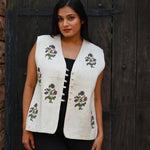 Ekaurr BIGDI Pure Blossom Jacket handcrafted cotton jacket in soft white or ivory with a delicate blossom print or embroidered floral surface, artisan slow fashion outerwear for women from the BIGDI collection