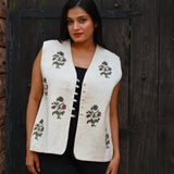 Ekaurr BIGDI Pure Blossom Jacket handcrafted cotton jacket in soft white or ivory with a delicate blossom print or embroidered floral surface, artisan slow fashion outerwear for women from the BIGDI collection
