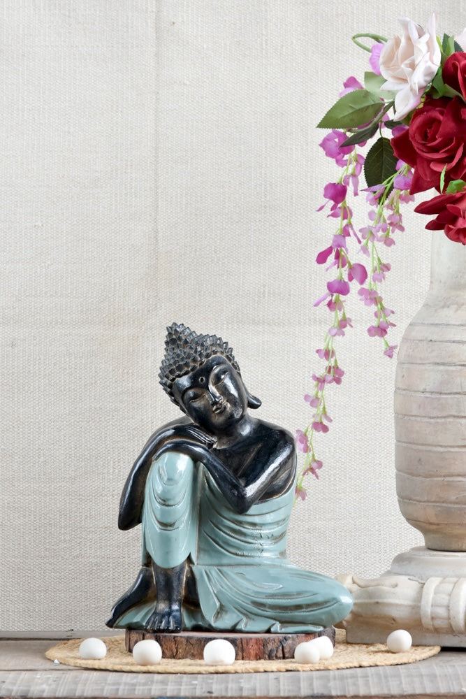 Ekaurr Resting Buddha handcrafted ceramic figurine in a reclined resting pose, artisan spiritual home decor sculpture for shelves, consoles and meditation spaces