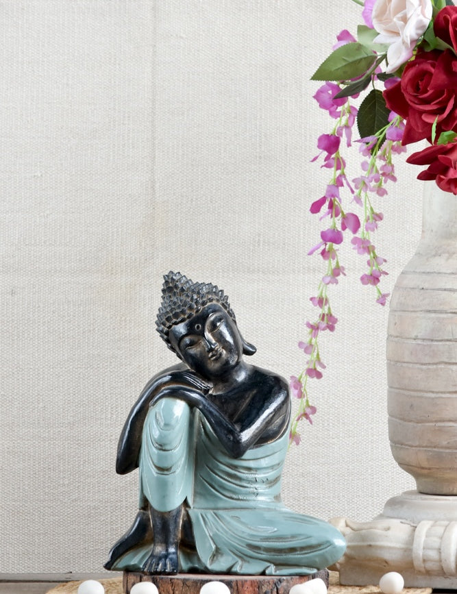 Ekaurr Resting Buddha handcrafted ceramic figurine in a reclined resting pose, artisan spiritual home decor sculpture for shelves, consoles and meditation spaces