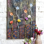 Ekaurr Rooted Bloom mixed-media wall art combining botanical root and bloom forms in layered earthy textures and natural tones, handcrafted nature-inspired home decor for living rooms and mindful interior styling
