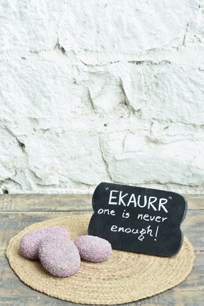 Ekaurr Ruby Essence Gift Set curated artisan gift set including a ruby-cladded natural stone paperweight and a rustic wooden emblem chalkboard with complimentary greeting card, luxury sustainable gifting for desks and home styling