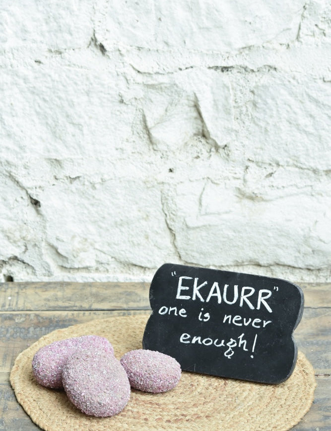 Ekaurr Ruby Essence Gift Set curated artisan gift set including a ruby-cladded natural stone paperweight and a rustic wooden emblem chalkboard with complimentary greeting card, luxury sustainable gifting for desks and home styling
