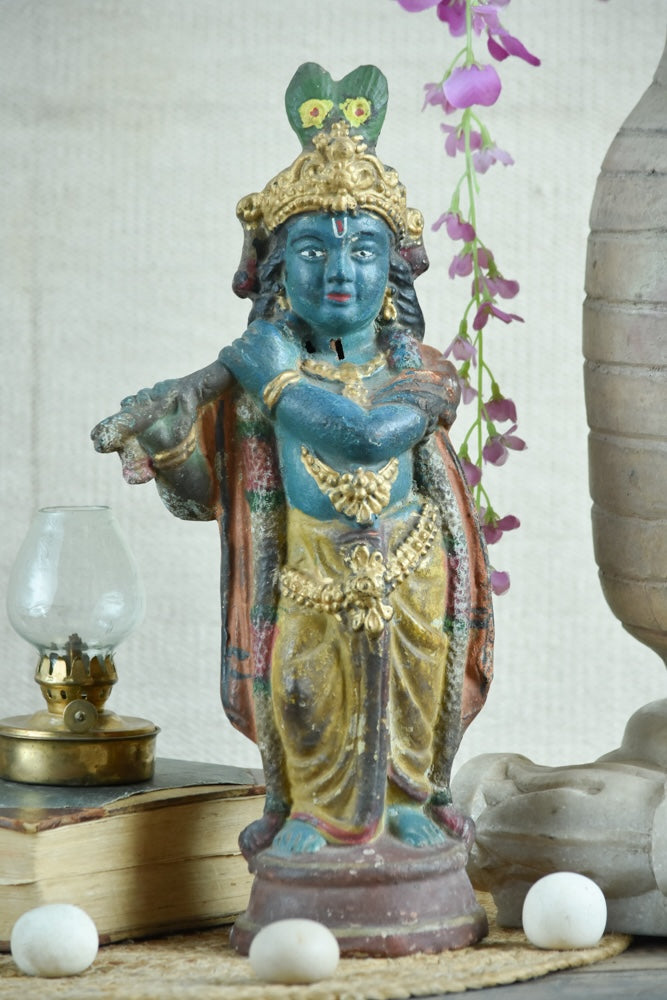 Ekaurr Rustic Harmony Lord Krishna hand-painted idol in traditional dark blue with gold drapery holding flute, vintage folk-style devotional figurine for pooja rooms and home decor
