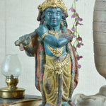 Ekaurr Rustic Harmony Lord Krishna hand-painted idol in traditional dark blue with gold drapery holding flute, vintage folk-style devotional figurine for pooja rooms and home decor