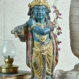 Ekaurr Rustic Harmony Lord Krishna hand-painted idol in traditional dark blue with gold drapery holding flute, vintage folk-style devotional figurine for pooja rooms and home decor