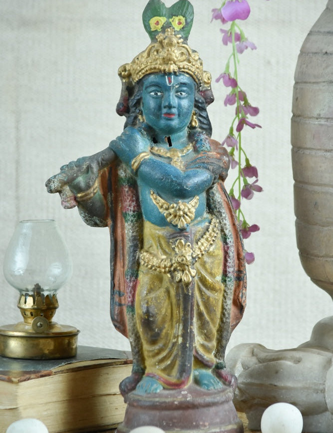 Ekaurr Rustic Harmony Lord Krishna hand-painted idol in traditional dark blue with gold drapery holding flute, vintage folk-style devotional figurine for pooja rooms and home decor