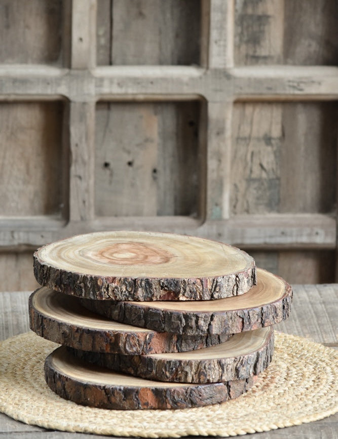 Ekaurr Rustic Tree Ring Platter round natural wood cross-section with exposed tree ring grain and raw bark edge, handcrafted wood serving base or table centrepiece available individually or in sets