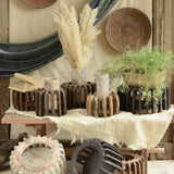 Ekaurr The Sanchey Circles EDIDA award-nominated multi-purpose décor showing reclaimed wood circular bases with vintage brick emblem halves, sustainable art installation