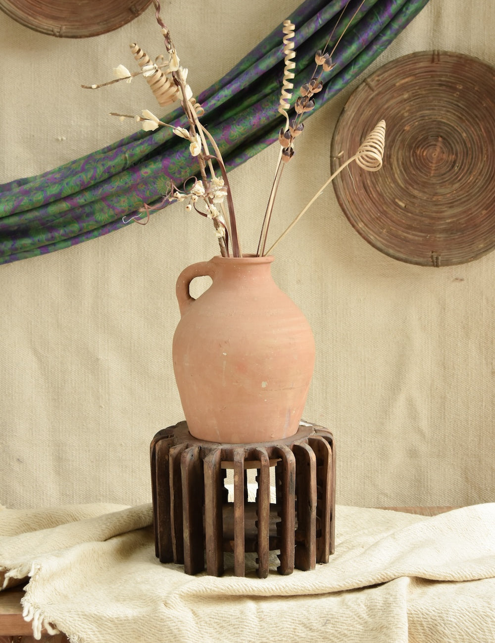 Ekaurr The Sanchey Circles styled with terracotta pots as planters, showing rustic botanical eco-conscious art installation