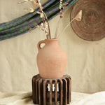 Ekaurr The Sanchey Circles styled with terracotta pots as planters, showing rustic botanical eco-conscious art installation