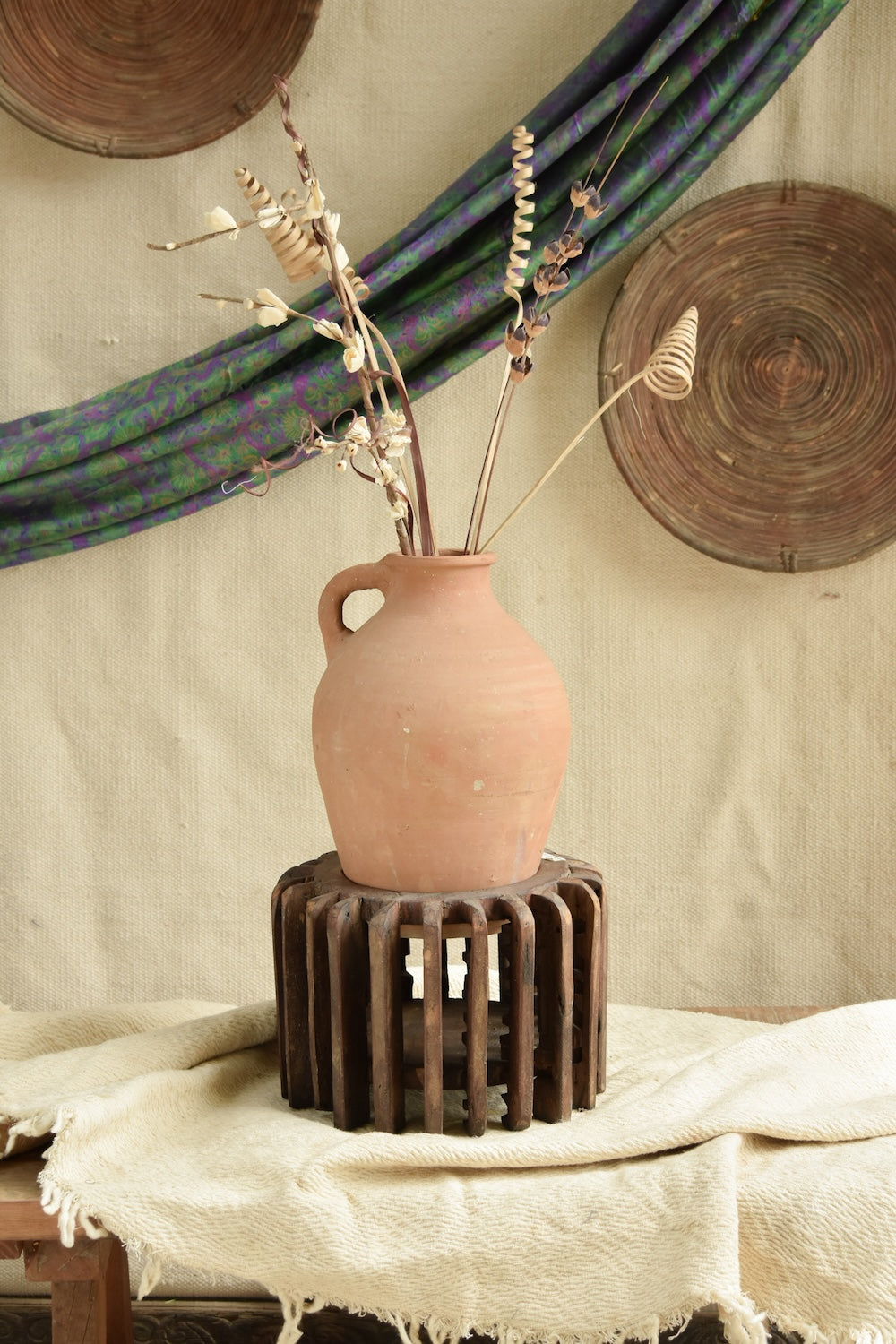 Ekaurr The Sanchey Circles styled with terracotta pots as planters, showing rustic botanical eco-conscious art installation