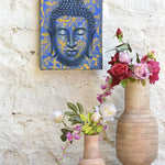 Ekaurr Serenity in Gold Buddha Wall Art original painting or mixed-media artwork of a serene Buddha figure in gold and warm tones, handcrafted spiritual wall art for meditation corners living rooms and sacred home spaces