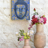 Ekaurr Serenity in Gold Buddha Wall Art original painting or mixed-media artwork of a serene Buddha figure in gold and warm tones, handcrafted spiritual wall art for meditation corners living rooms and sacred home spaces