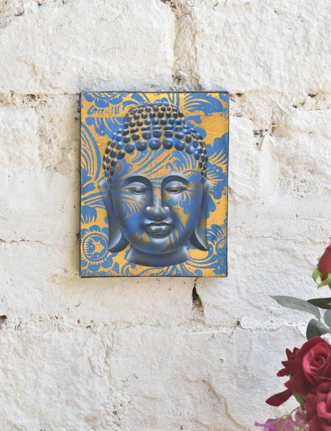 Ekaurr Serenity in Gold Buddha Wall Art original painting or mixed-media artwork of a serene Buddha figure in gold and warm tones, handcrafted spiritual wall art for meditation corners living rooms and sacred home spaces