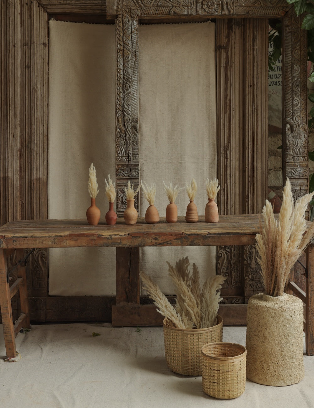 Ekaurr Set of 7 Terracotta Planters all shapes displayed together natural earthy tone handmade by rural Indian women artisans