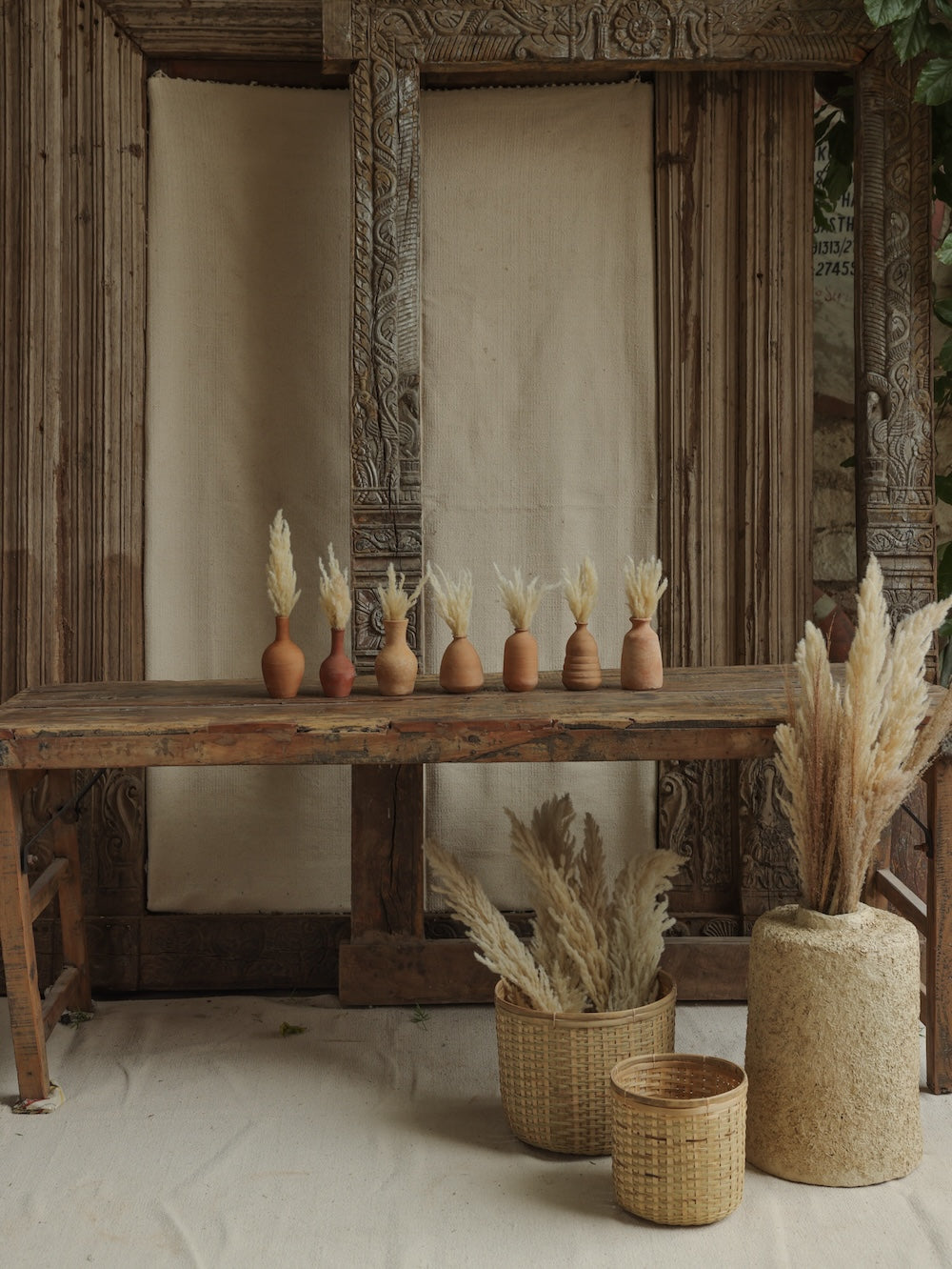 Ekaurr Set of 7 Terracotta Planters all shapes displayed together natural earthy tone handmade by rural Indian women artisans