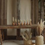 Ekaurr Set of 7 Terracotta Planters all shapes displayed together natural earthy tone handmade by rural Indian women artisans