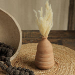 Ekaurr Set of 7 Terracotta Planters styled on a console with plants and frames handmade women empowerment decor