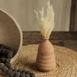 Ekaurr Set of 7 Terracotta Planters styled on a console with plants and frames handmade women empowerment decor