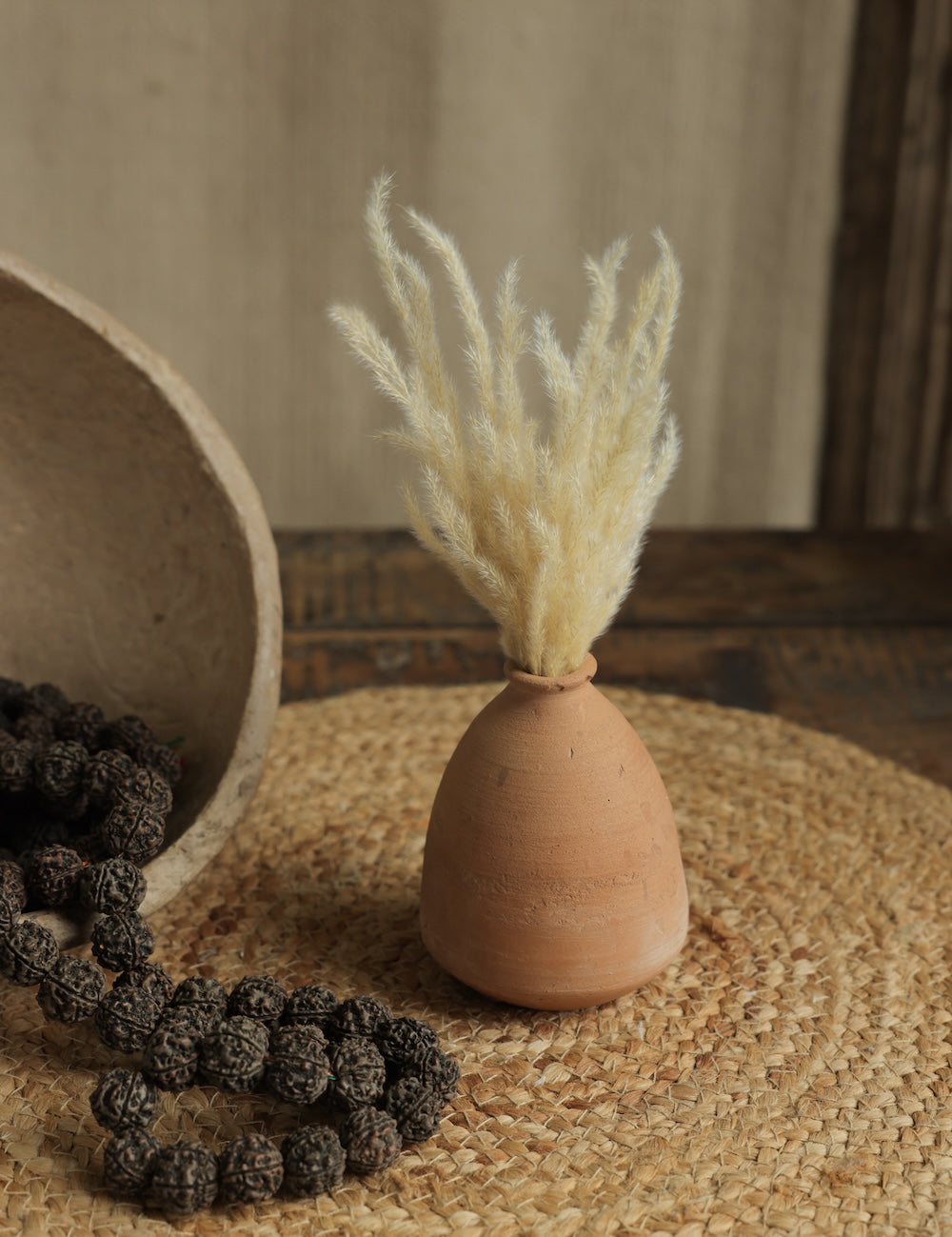 Ekaurr Set of 7 Terracotta Planters showing tall elongated forms natural terracotta finish handmade sustainable home decor