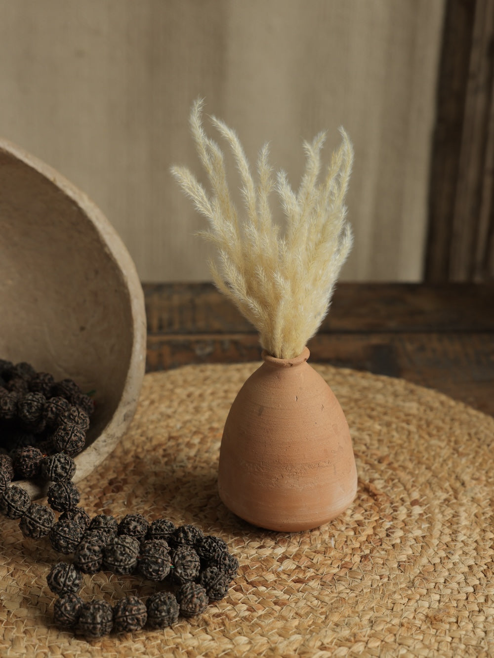 Ekaurr Set of 7 Terracotta Planters showing tall elongated forms natural terracotta finish handmade sustainable home decor