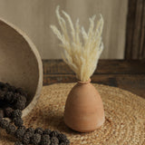 Ekaurr Set of 7 Terracotta Planters showing tall elongated forms natural terracotta finish handmade sustainable home decor