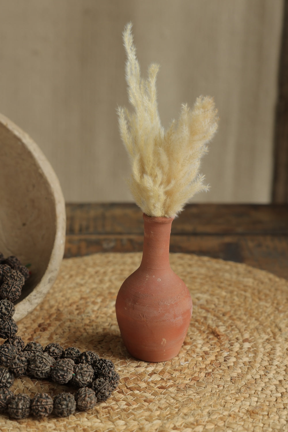 Ekaurr Set of 7 Terracotta Planters round compact forms styled on a shelf with faux plants indoor home decor display